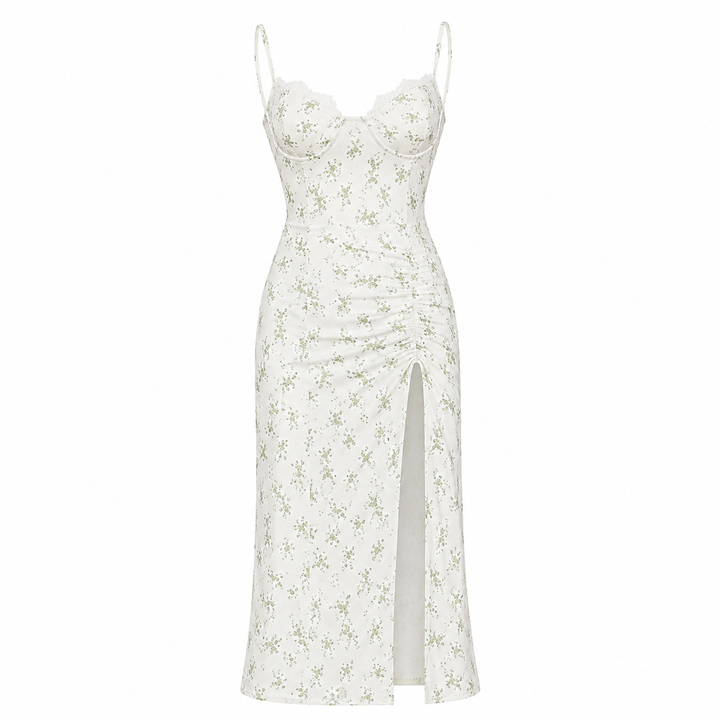 Ermeløs blomstret midikjole til dame, åpen rygg og sidesplitt. Elegant figurnær design, perfekt sommer- og festkjole.