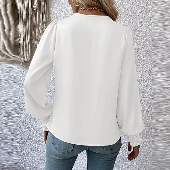 Elegant blusetopp med V-hals og ballongermer for dame. Stilfull mote topp i komfortabelt stoff.