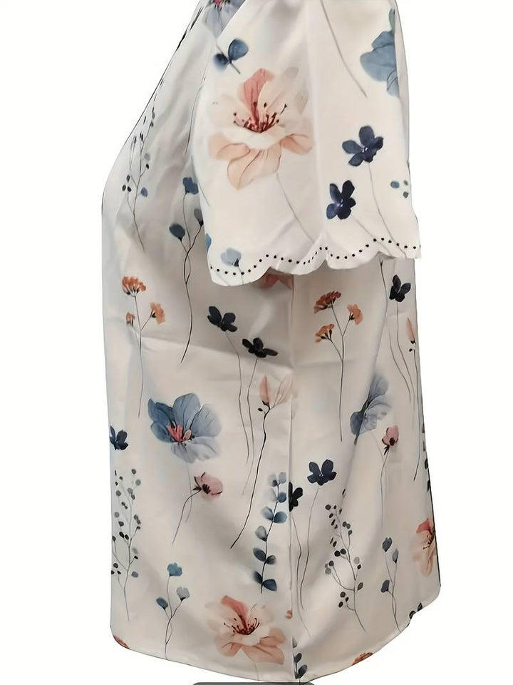 Løs og ledig vårbluse for kvinner med vakkert, detaljert blomstertrykk.