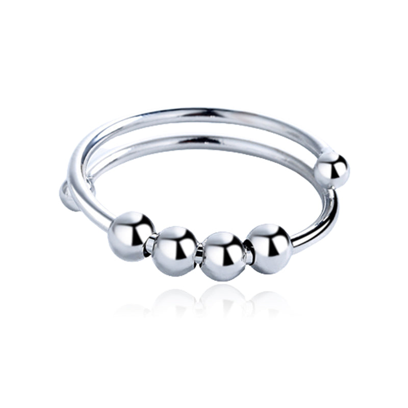 Minimalistisk justerbar angstring med fire bevegelige perler, et elegant tilbehør for daglig stressmestring.