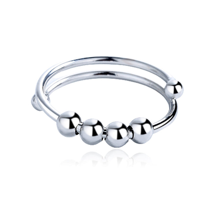 Minimalistisk justerbar angstring med fire bevegelige perler, et elegant tilbehør for daglig stressmestring.
