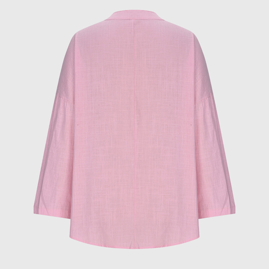 Feminin langermet topp med løs passform, perfekt som komfortable dameklær for en avslappet og stilig look.