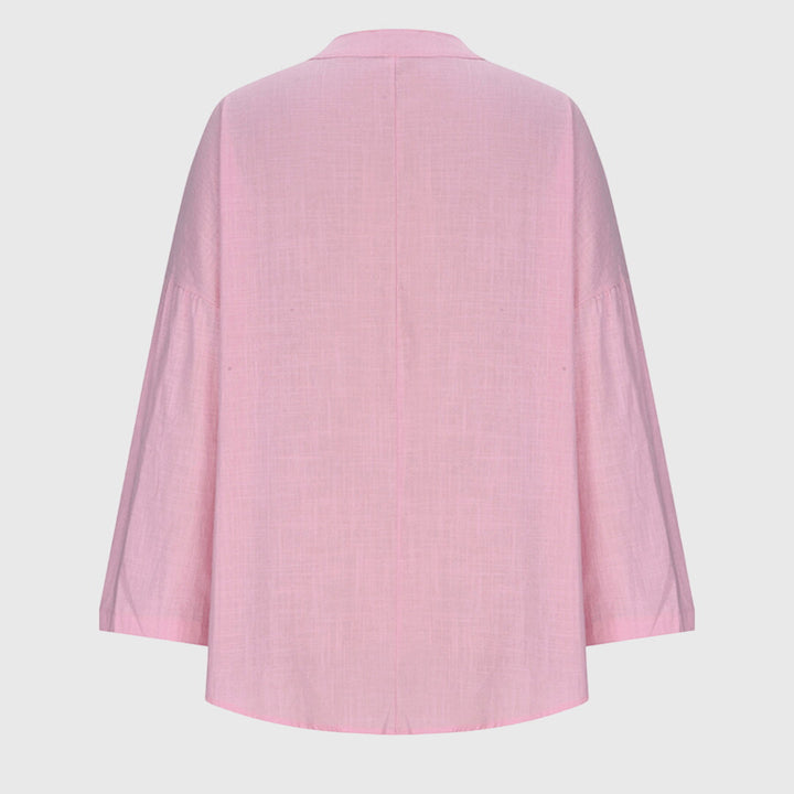 Feminin langermet topp med løs passform, perfekt som komfortable dameklær for en avslappet og stilig look.