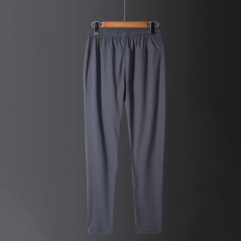 Hurtigtørkende, pustende fritidsbukse for sporty menn og kvinner. Elastisk og komfortabel joggebukse for alle dager.