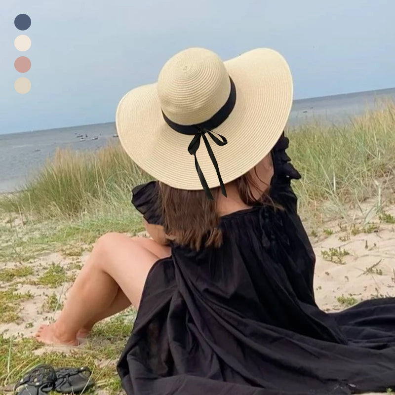 Dame sommerhatt med bred kant for effektiv solbeskyttelse, perfekt mot solen.