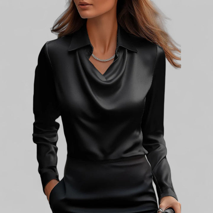 Festtopp for kvinner. Elegant bluse med lange ermer og raffinert vannfallutringning.