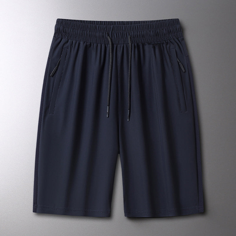 Aktive menns sportsshorts i elastisk stoff, designet for løping og sommeraktiviteter.
