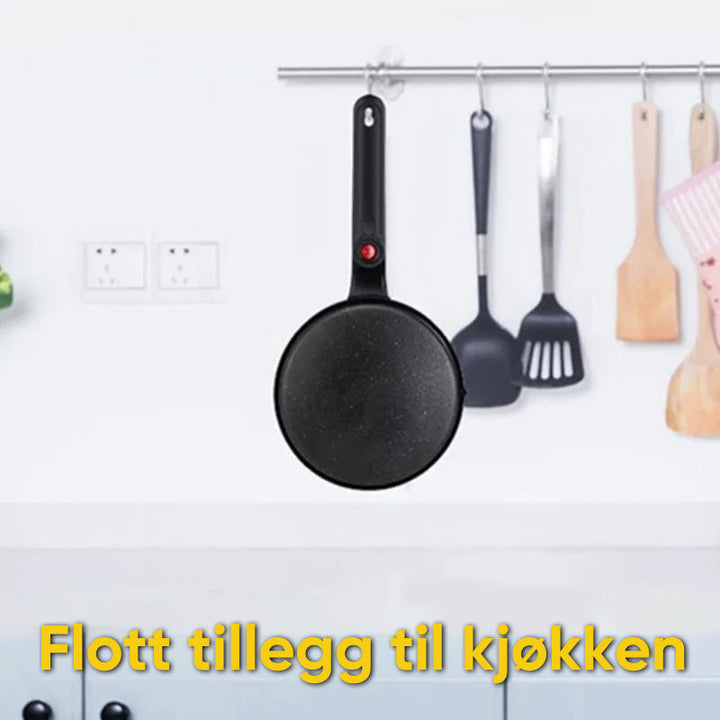 Levende rød/oransje bærbar pannekakemaskin. Nyt raske, non-stick crêpes for en perfekt frokost.