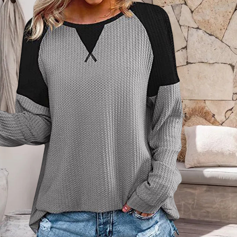 Elegant langermet t-skjorte med rund hals. Perfekt som allsidig topp for høsten og kjøligere dager.