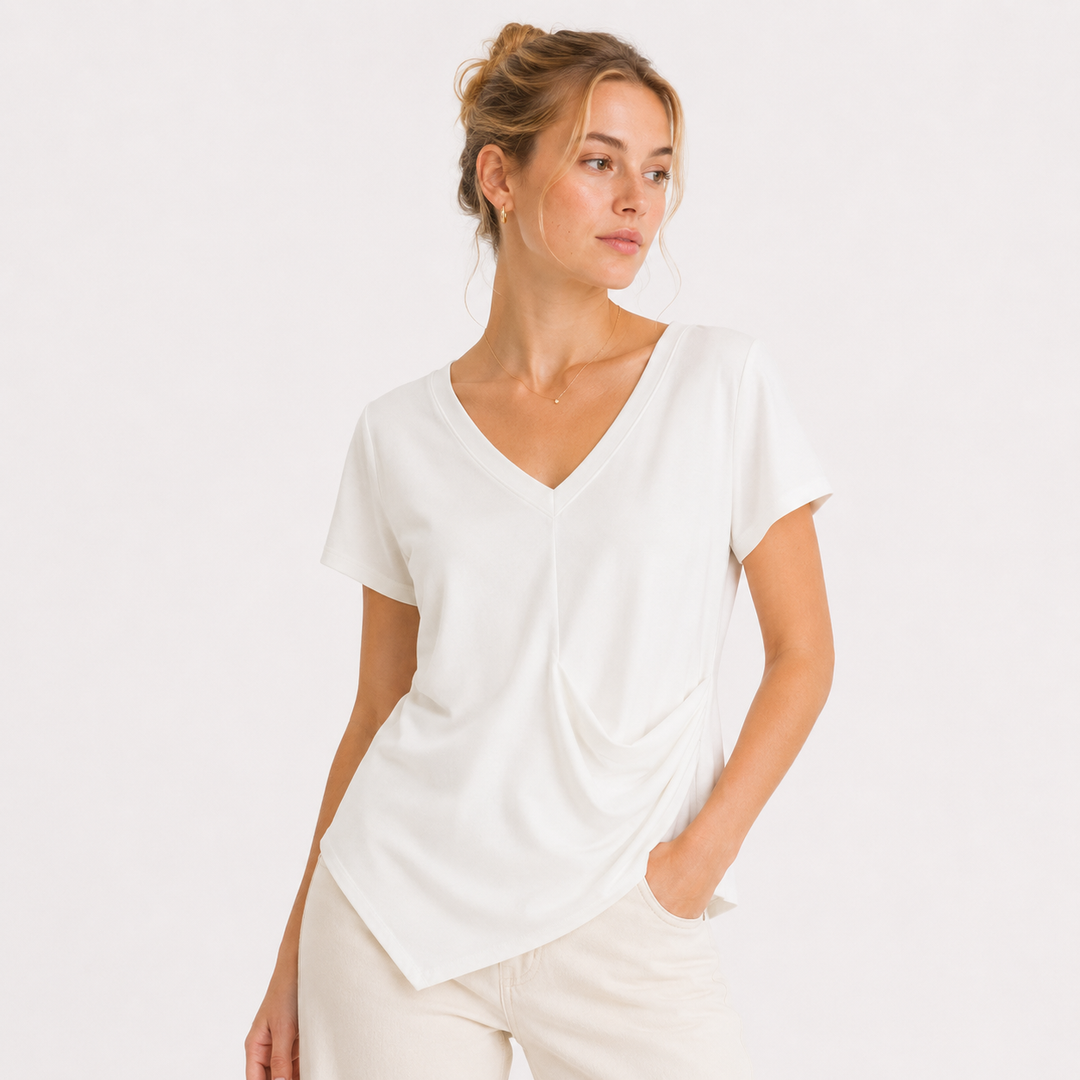 Svart elegant dame topp med V-hals, drapert midje og asymmetrisk design, perfekt for fest.