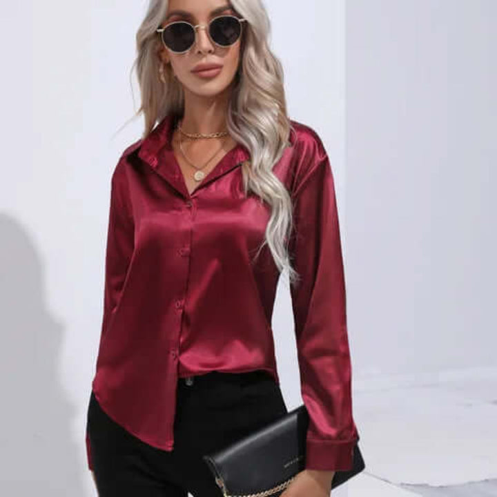 Stilig damebluse med løse ermer, elegant design, ideell som festtopp.