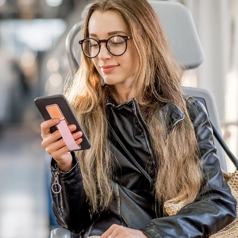 Smart telefontilbehør: Selvklebende grep og stativ for komfortabel mobilbruk.