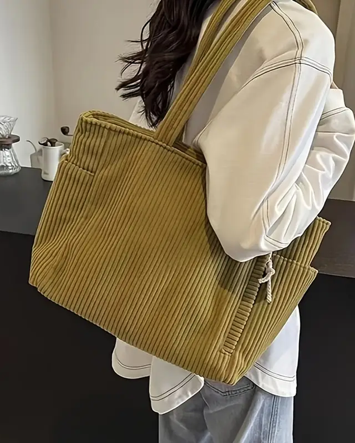 Sennepsgul dame hverdagsveske med trendy snordetalj. Elegant og praktisk skulderveske.