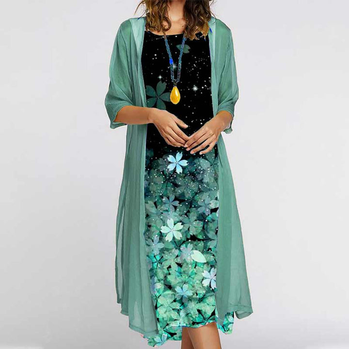 Flytende dame todelt blomsterkjole i chiffon. Mønstret langkjole med rund hals og omslag, perfekt elegant stil.