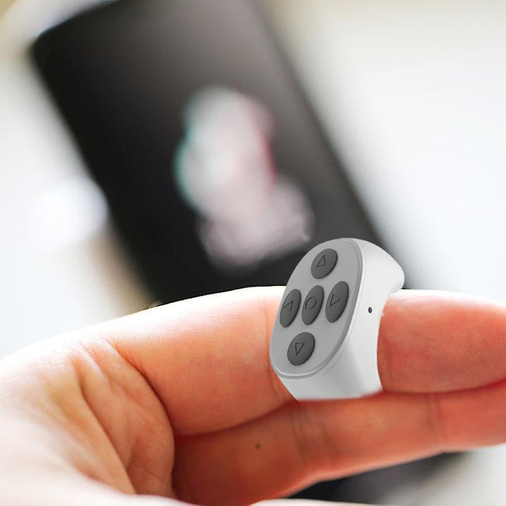 Ergonomisk fingertupp-fjernkontroll for mobil, trådløs Bluetooth-teknologi for optimal komfort.