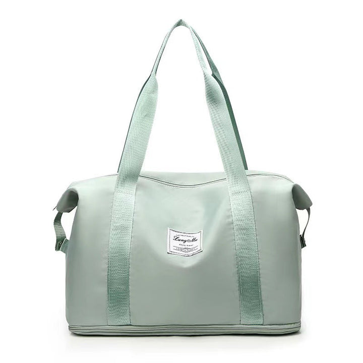 Fleksibel duffelbag som kan bæres som håndbagasje, med smart våtseparasjon.