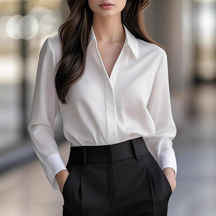 Stilig svart kragebluse for kvinner med lange ermer. Elegant og komfortabel for både jobb og fritid.