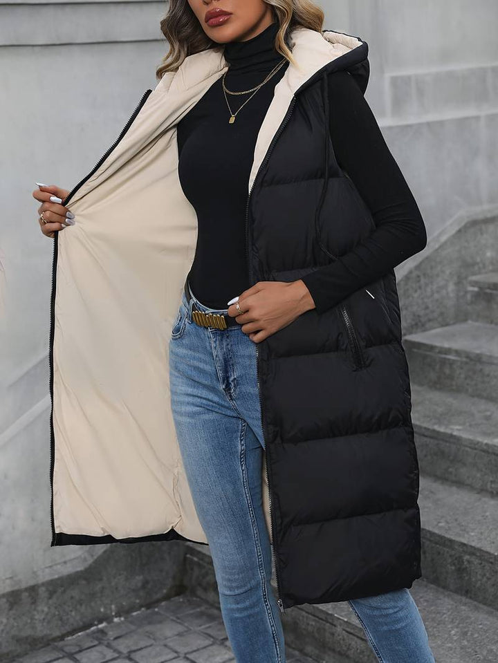 Lang elegant dame hettevest i svart, perfekt for en casual eller pyntet stil, myk og behagelig.