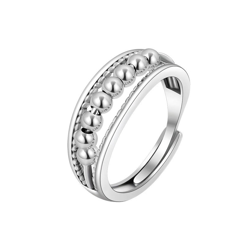 Elegant fidget ring i platina, unisex design for stressreduksjon og daglig ro.