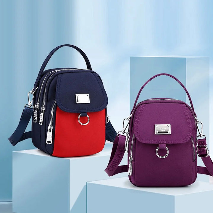 Vanntett crossbody-veske for kvinner, praktisk og romslig for shopping og reise.