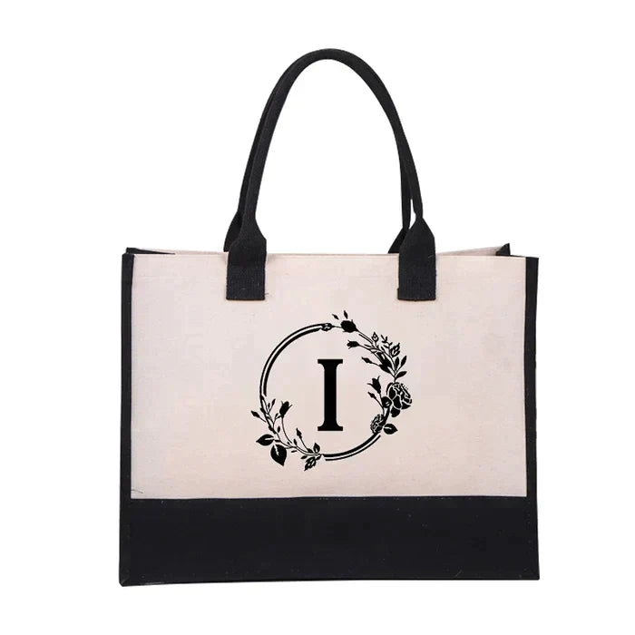 Elegant shoppingbag i lerret med bokstavtrykk, en flott gaveidé.