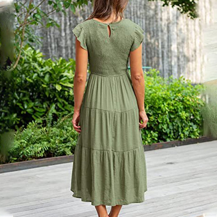 Ensfarget midi volangkjole for dame. Pustende sommerkjole i bomullsblanding, perfekt og elegant.