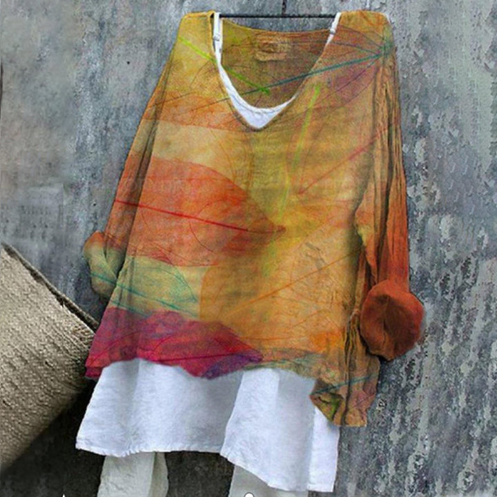 Nydelig langermet kvinnebluse med fargerikt blomstret print og elegant v-hals for daglig bruk.