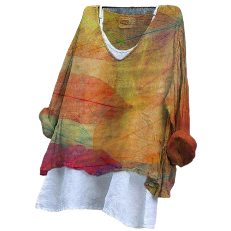 Stilig kvinnebluse med blomsterprint, v-hals og lange ermer, perfekt for sommer- eller høstantrekk.