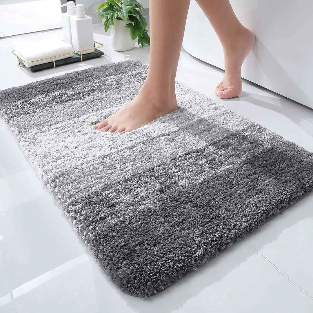Absorberende badematte med rask tørk funksjon. Komfortabel og hygienisk dusjmatte for baderomsgulvet.