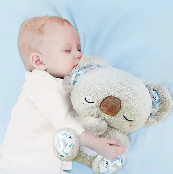 Kosedyr koala pusteleketøy med integrert nattlys, skaper rolig atmosfære for avslapning og søvn.