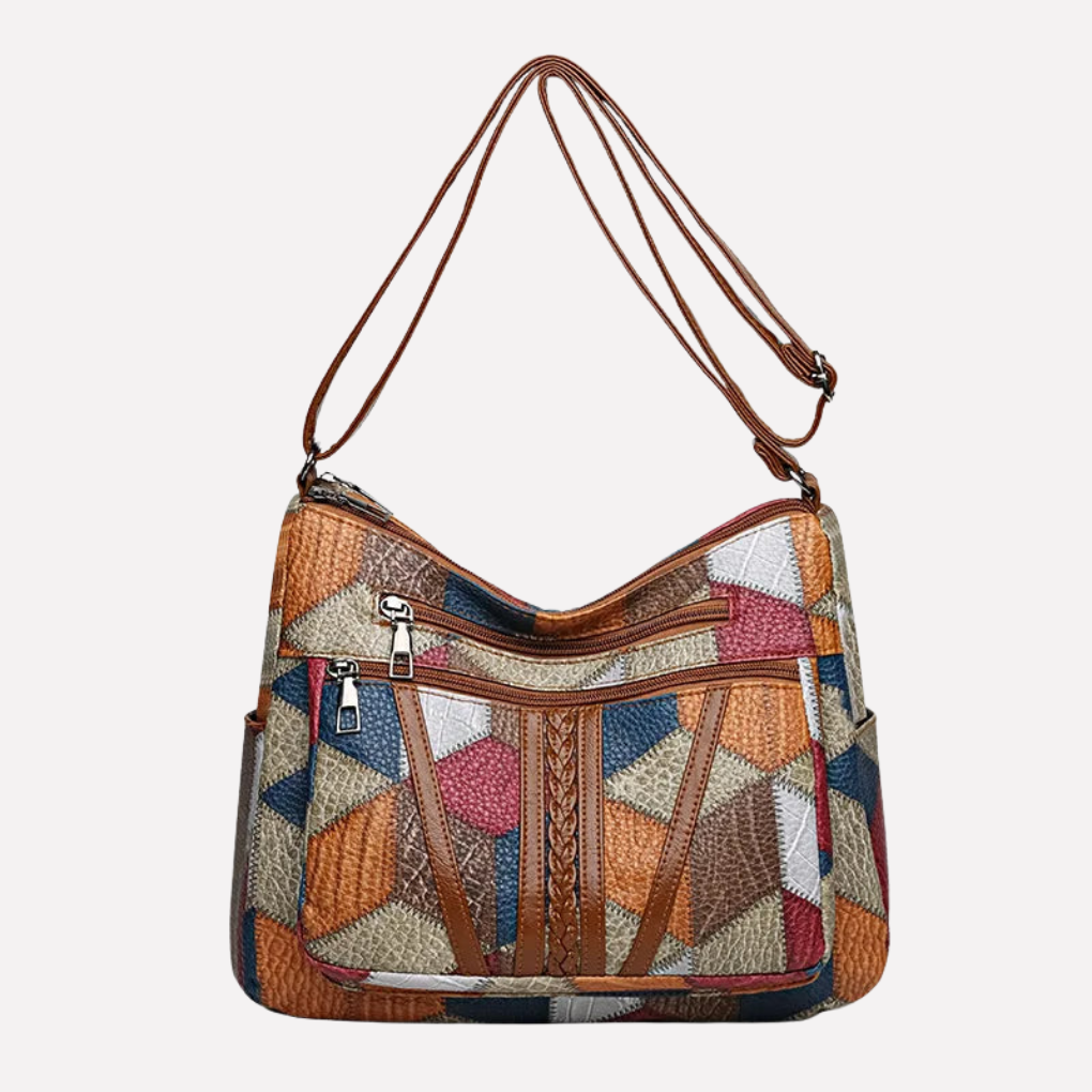 Stilfull kvinners lappeteppe håndveske i vegansk skinn, perfekt som skulderveske eller crossbody til hverdagsbruk.