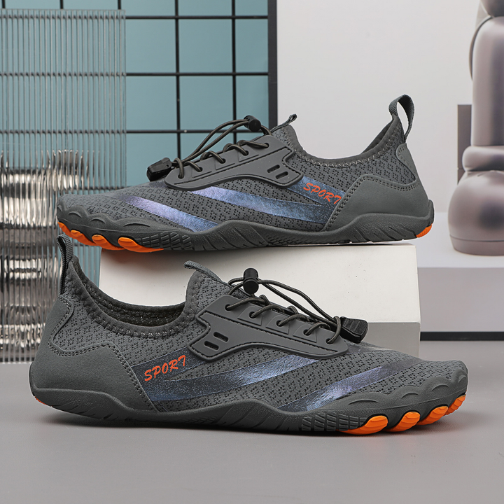 Komfortabel unisex barfotsko med bred tåboks, perfekt for naturlig gange og daglig bruk.