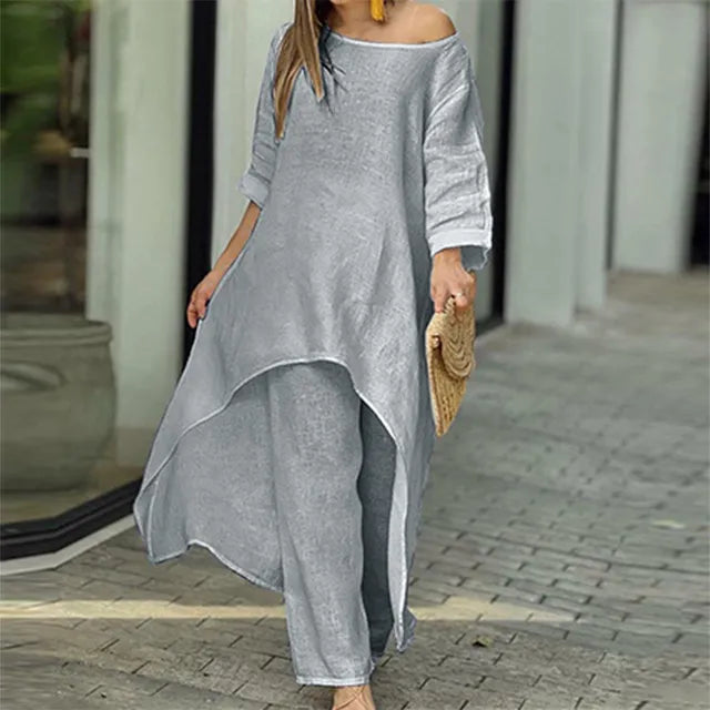 Nærbilde av løs off-shoulder lin topp fra et komfortabelt kvinnesett, ideelt for varmt vær.