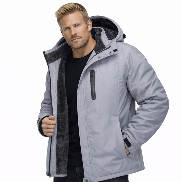 Herre vindjakke, robust softshell, vanntett og vindtett, essensiell for kalde vinterdager ute.