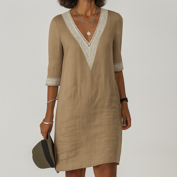 Elegant hvit sommerkjole i lin for kvinner, perfekt for varme dager og avslappet stil.