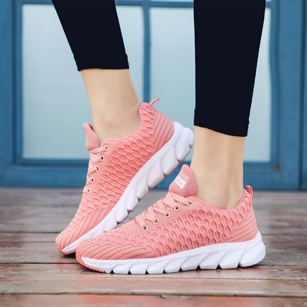 Stilige unisex sneakers i rosa, svart og hvitt. Allsidige joggesko som kombinerer hverdagskomfort og fritidsstil.