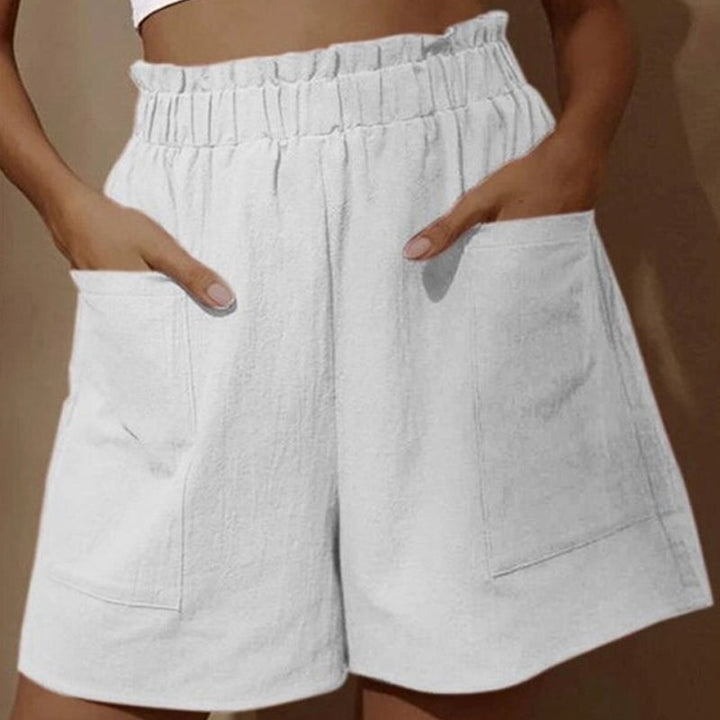 Kvinner shorts med høy og elastisk midje, en flatterende passform for en trendy og avslappet look.