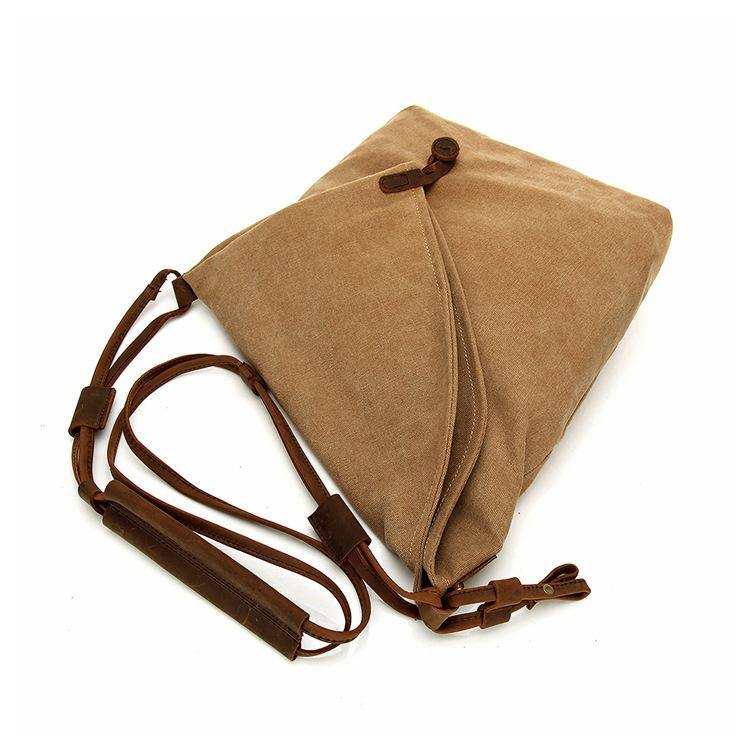 Stilfull bohemsk dameveske, en praktisk crossbody i slitesterkt lerret og skinn med justerbar stropp.