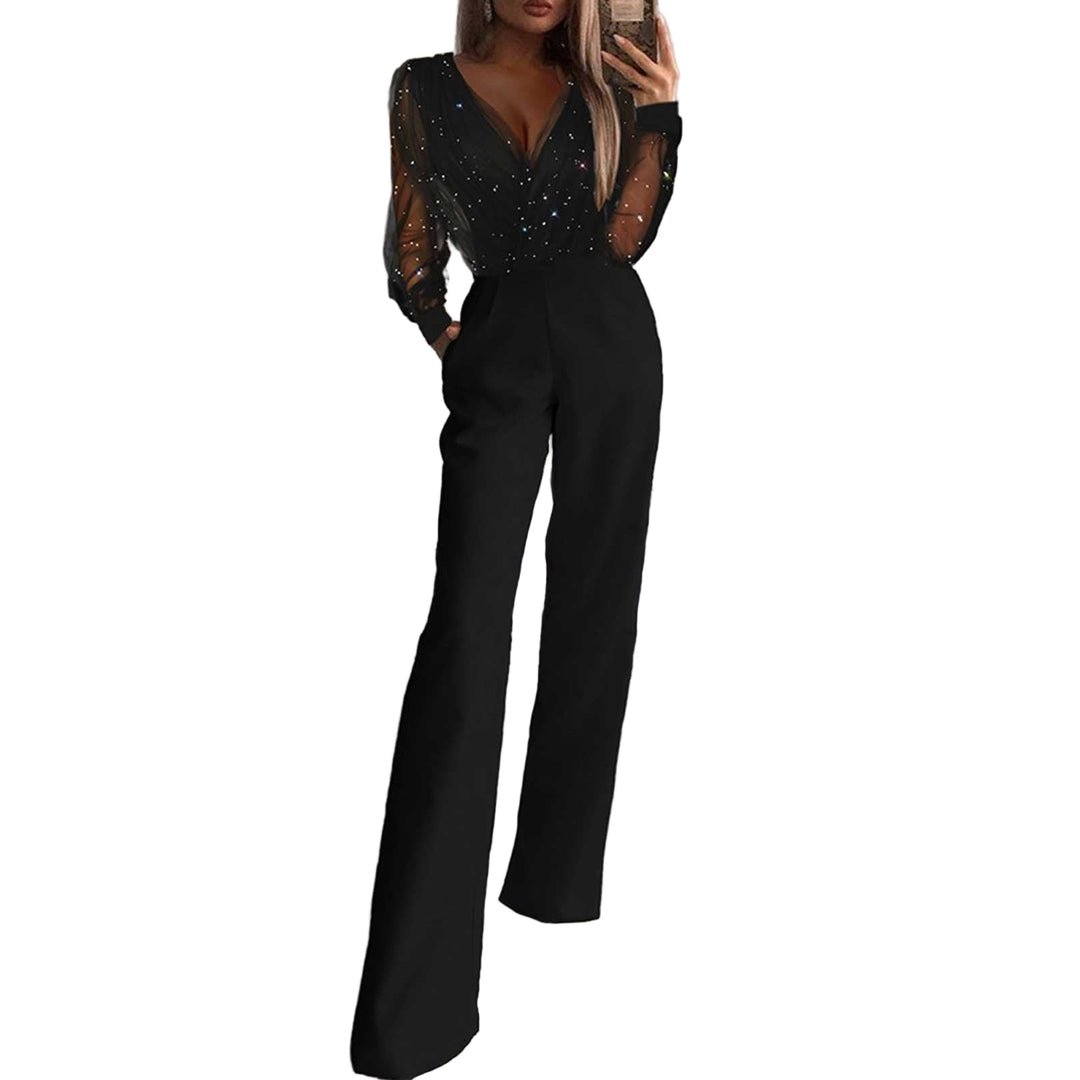 Elegant damejumpsuit med lange ermer og vidben, perfekt festantrekk for selskap.