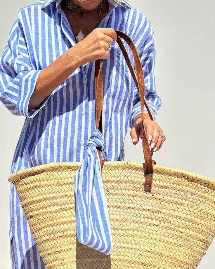 Moderne dame skjortekjole med striper; elegant og komfortabel for en uformell, men stilfull look.