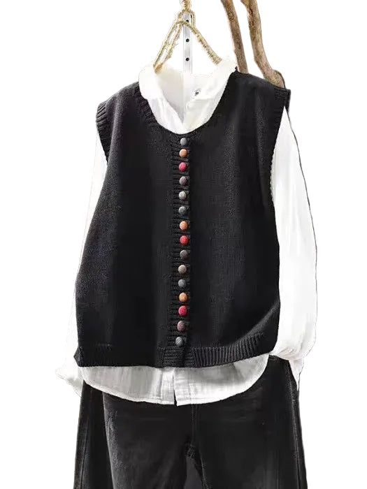 Løs, komfortabel dame strikkevest med rund hals for lagdeling. Myk motevest i strikk til kvinner.