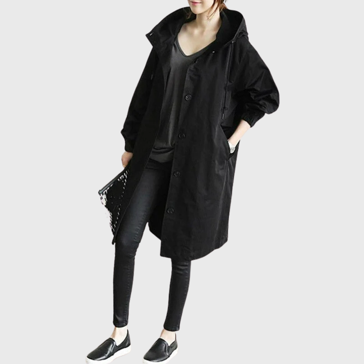 Elegant dame ytterjakke i vannavstøtende stoff, ideell for regnfulle dager og hverdagsbruk.