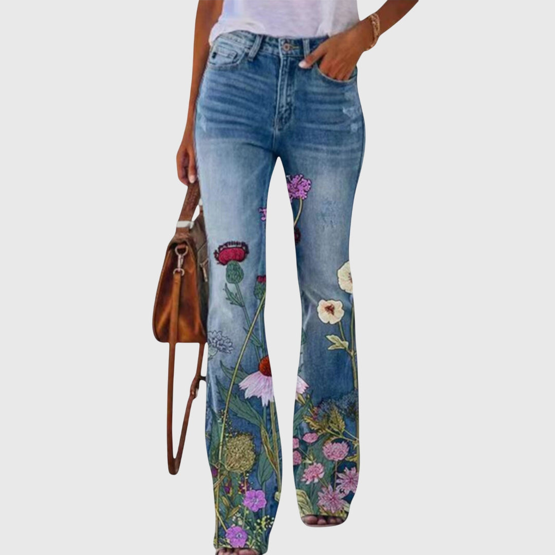 Stilige vide ben bukser med unikt blomsterdesign. Mønstrede damebukser for en chic vår- og sommerlook.