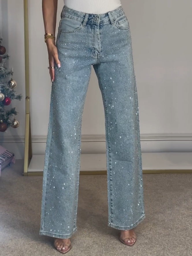 Stilige festjeans for kvinner, mørkeblå med høy midje og subtilt glitter. Komfortabel passform.