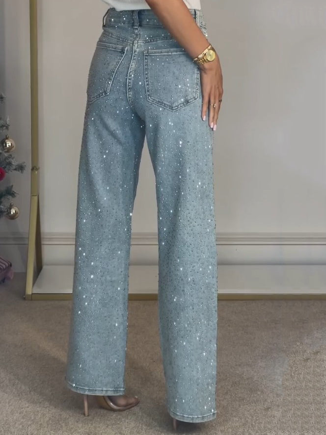 Damejeans i mørkeblå med høy midje, glitrende sømmer og tettsittende design. Komfortable hverdagsjeans.