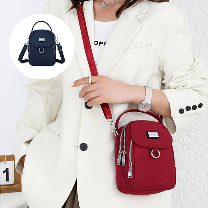 Moderne dameveske, vanntett crossbody-veske for reise og fritidsaktiviteter.