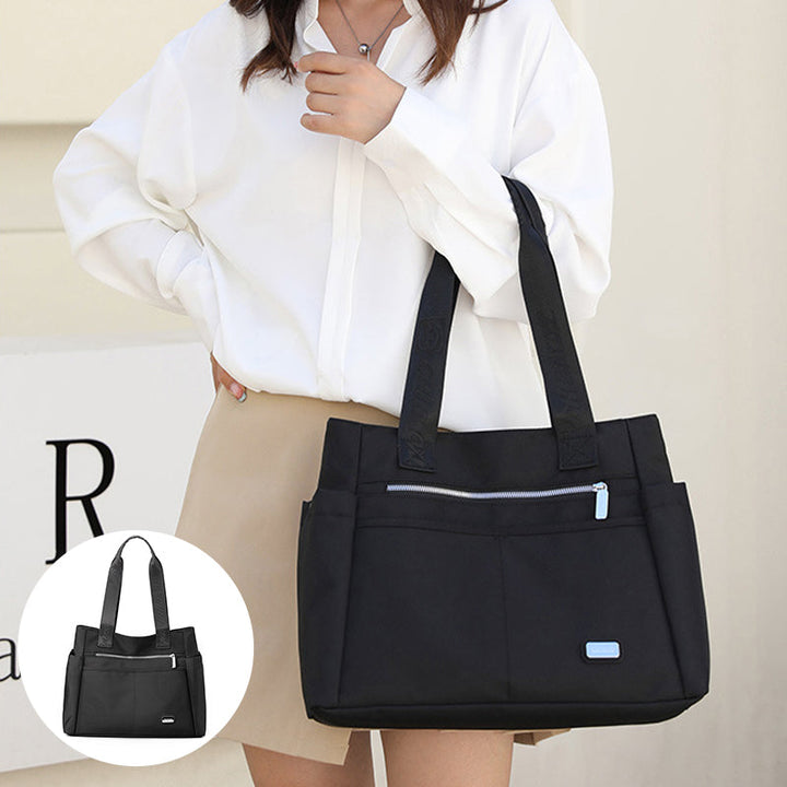 Moderne vanntett messenger bag, praktisk for kontor og fritidsaktiviteter.