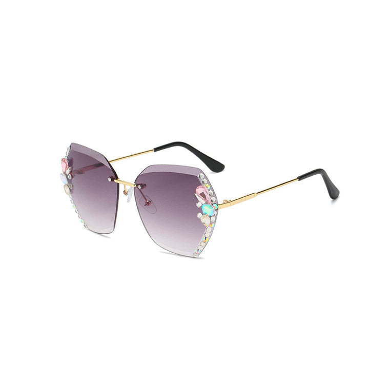 Elegante dame solbriller uten ramme med glitrende strassdetaljer og UV400-beskyttelse.