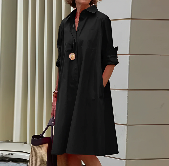 Flatterende langermet midi kjole for kvinner. Komfortabel og elegant design, ideell som sommerkjole eller vårkjole.