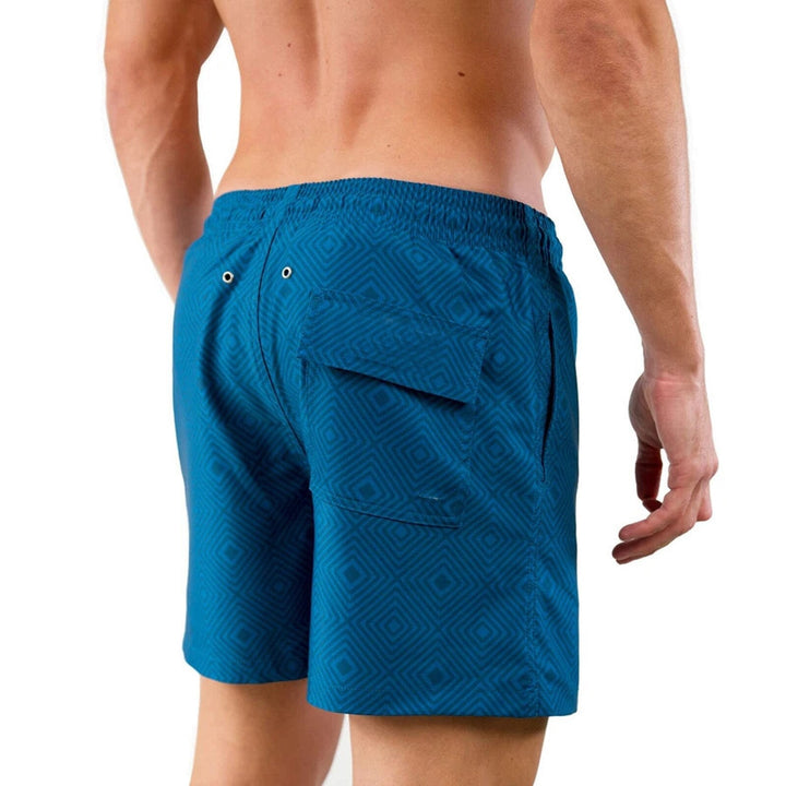 Stilige herre badeshorts med integrert kompresjon. Perfekt for stranden, sport og aktiv sommerbruk.